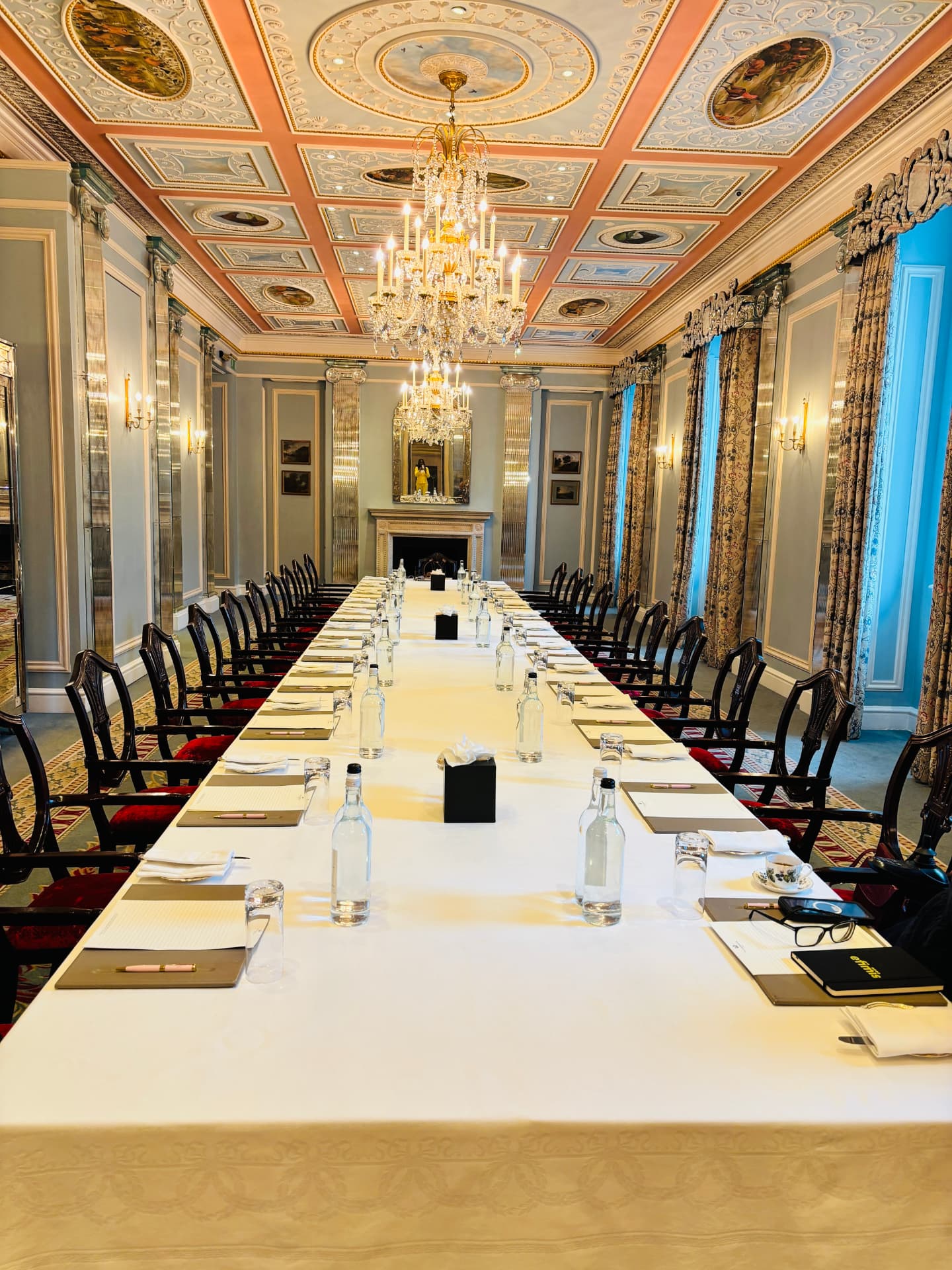 Roundtable room set for the summit at a grand London venue